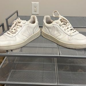 Size 8 Veja sneakers in white.